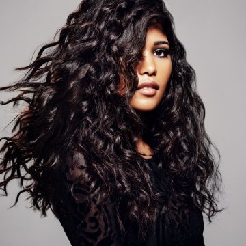 hair dryers best black hair woman with beautiful long black curly hair gray background